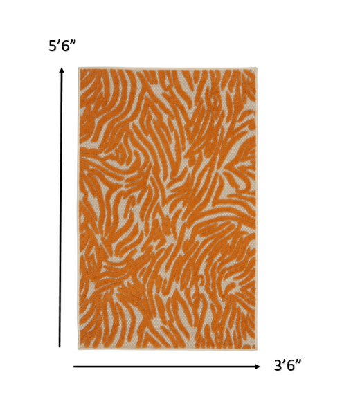 4’ x 6’ Orange Zebra Pattern Indoor Outdoor Area Rug