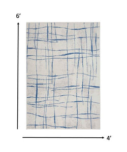 4’ x 6’ Ivory and Blue Irregular Grids Area Rug