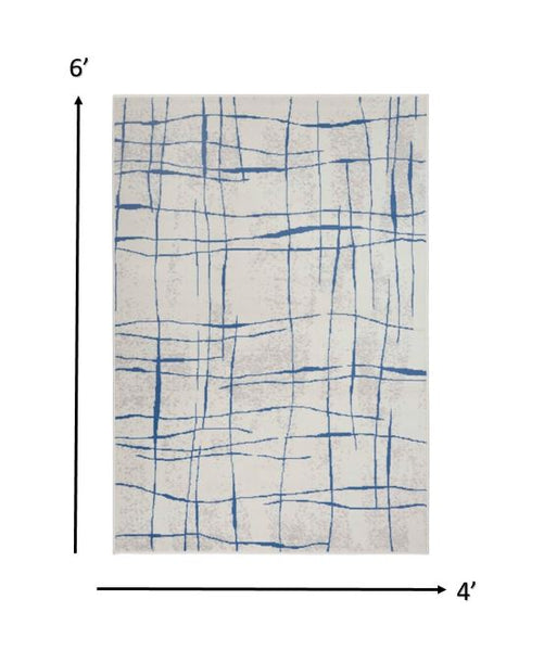 4’ x 6’ Ivory and Blue Irregular Grids Area Rug