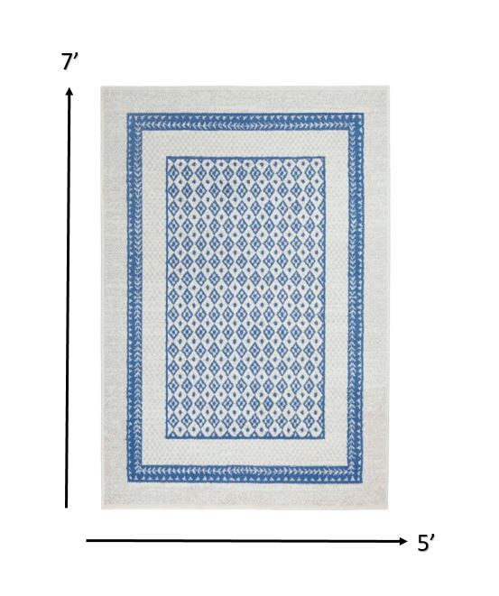 5’ x 7’ Ivory and Blue Geometric Area Rug