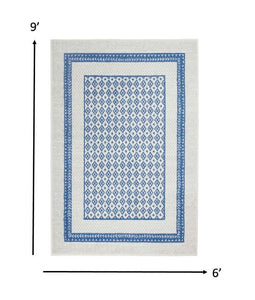 6’ x 9’ Ivory and Blue Geometric Area Rug